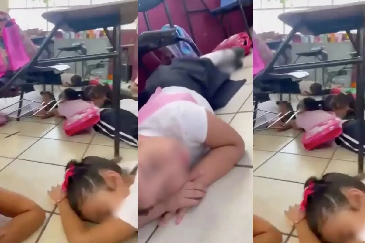 Niños en el piso de primaria. Foto: Captura de video en redes sociales